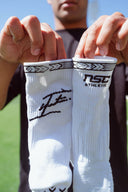 Isaiya Katoa holding NSC Athletic Grip Socks 2.0